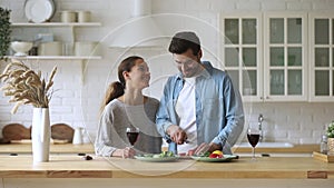 Happy loving family couple preparing food for romantic home dating.