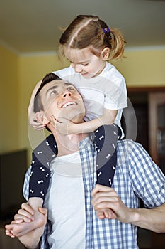 Happy loving family. Father and his daughter child girl playing and hugging. Concept of Father`s day.