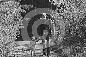 Happy loving family. Father and his daughter child girl playing and hugging outdoors. Cute little girl hugs daddy. Concept of