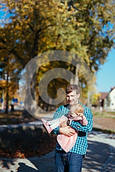 Happy loving family. Father and his daughter child girl playing and hugging outdoors. Cute little girl hugs daddy. Concept of