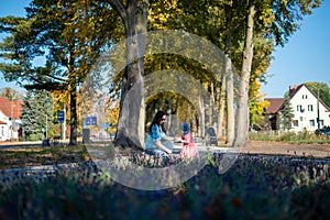 Happy loving family. Father and his daughter child girl playing and hugging outdoors. Cute little girl hugs daddy. Concept of