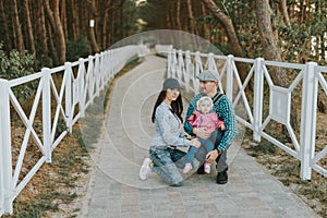 Happy loving family. Father and his daughter child girl playing and hugging outdoors. Cute little girl hugs daddy. Concept of