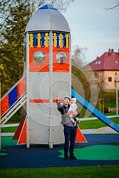 Happy loving family. Father and his daughter child girl playing and hugging outdoors. Cute little girl hugs daddy. Concept of