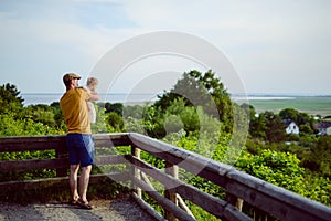 Happy loving family. Father and his daughter child girl playing and hugging outdoors. Cute little girl hugs daddy. Concept of