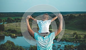 Loving family. Father and his son baby boy playing and hugging outdoors. Happy dad and son outdoors. Concept of Father`s day.