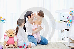 Happy loving family. mother and child girl playing,smiling.