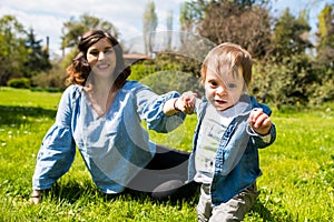 Happy loving family. mother and child playing in the park