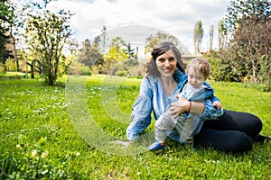 Happy loving family. mother and child playing in the park