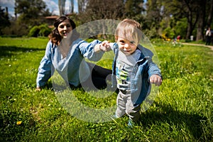 Happy loving family. mother and child playing in the park