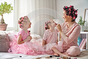 Mom and children doing makeup photo