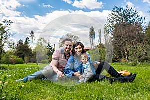 Happy loving family. mother father and child in the park