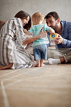 Happy loving family. mother and father playing with her baby at