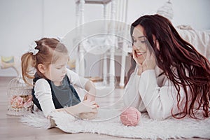 Happy loving family. Mother and her daughter child girl playing