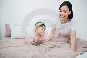 Happy loving family. Mother and her daughter child girl playing