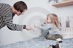 Happy loving family. Mother and her daughter child girl playing and hugging