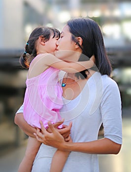 Happy loving family. Mother and her daughter child girl playing and hugging