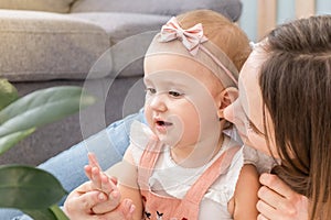 Happy loving family. Mother and her daughter child girl playing and hugging