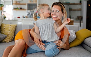 Happy loving family. Mother and her daughter child girl playing and hugging together at home