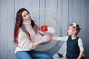 Happy loving family. Mother and her daughter child girl playing together