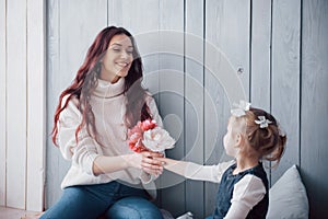 Happy loving family. Mother and her daughter child girl playing together