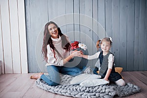 Happy loving family. Mother and her daughter child girl playing together