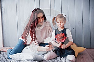 Happy loving family. Mother and her daughter child girl playing together