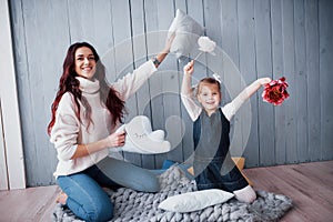 Happy loving family. Mother and her daughter child girl playing together