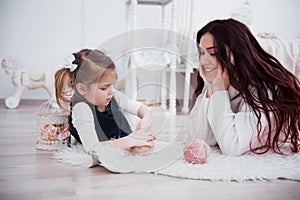 Happy loving family. Mother and her daughter child girl playing together