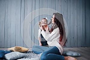 Happy loving family. Mother and her daughter child girl playing together