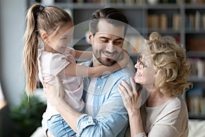 Happy loving multigenerational family communicating at home.