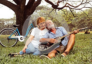 Happy loving senior couple spending the day in the countryside and having fun. concept about seniority and people