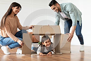 Happy loving young arab family having fun on moving day