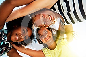 Happy, low angle and portrait of kids on camp for friendship, playing and fun together. Diversity, youth and girls