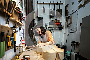 Happy Luthier Working in Atelier