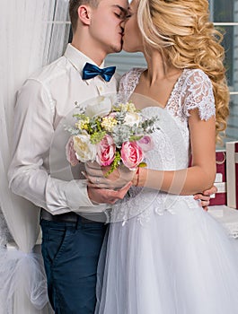 Happy luxury bride and groom in interior studio