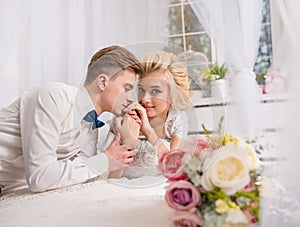 Happy luxury bride and groom in interior studio