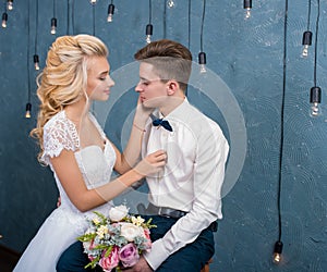 happy luxury bride and groom in interior studio