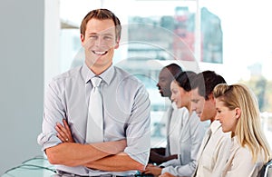 Happy male boss leading his team photo