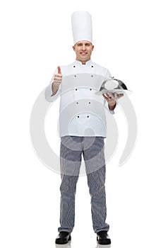 Happy male chef cook with cloche showing thumbs up