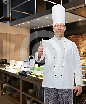 Happy male chef cook showing thumbs up