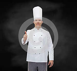 Happy male chef cook showing thumbs up