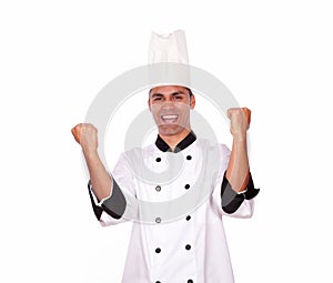 Happy male chef showing winning gesture with hands