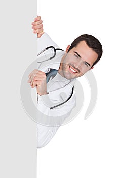 Happy Male Doctor Holding Empty Placard