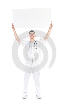 Happy male doctor holding empty placard over his head