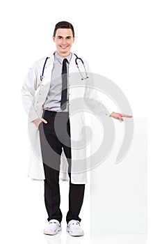 Happy male doctor posing with empty poster