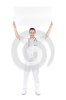 Happy male doctor showing empty placard over his h