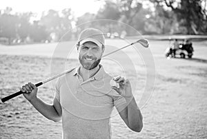 happy male golf player on professional course with green grass hold ball, golf