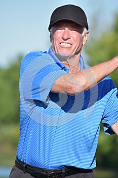 Happy Male Golfer With Golf Club Playing Golf