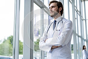 Happy male medical doctor portrait in hospital.