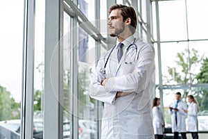 Happy male medical doctor portrait in hospital.